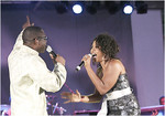 With Divine Brown, singing 